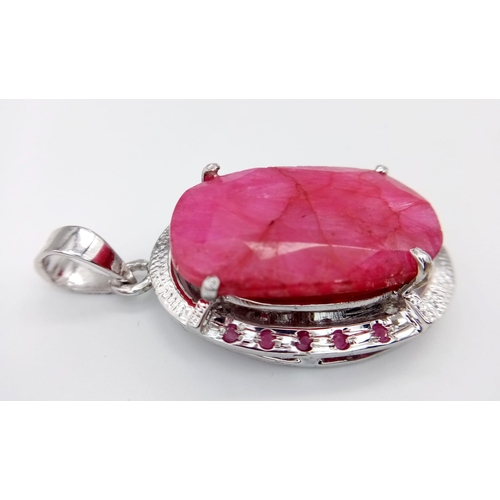 787 - An Oval Shape Ruby Gemstone Pendant set in 925 Silver with Ruby Accents. 24.20g total weight. 95ctw ... 