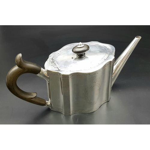 129 - A 1785 Hester Bateman George III Silver Teapot. Oval form with empty cartouche to side. Minimalist g... 