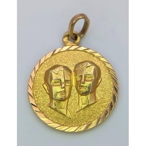 631 - A 22K Yellow Gold Gemini Pendant. 2cm diameter. 2.9g weight.