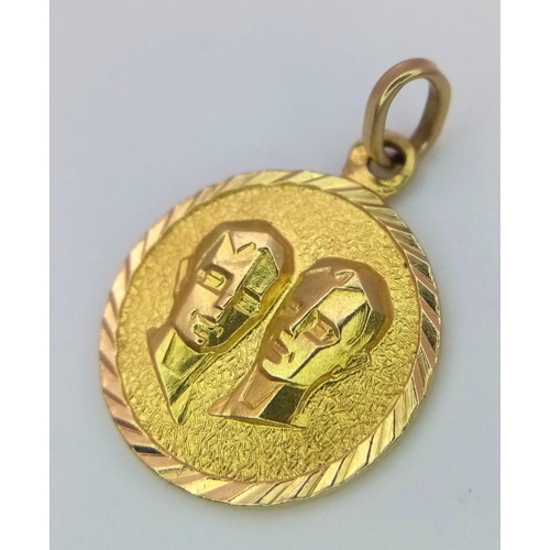 631 - A 22K Yellow Gold Gemini Pendant. 2cm diameter. 2.9g weight.