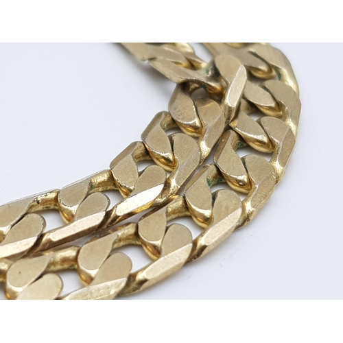 143 - A Vintage Italian 9K Yellow Gold Flat Curb Link Chain. 74cm length. 34.3g weight.