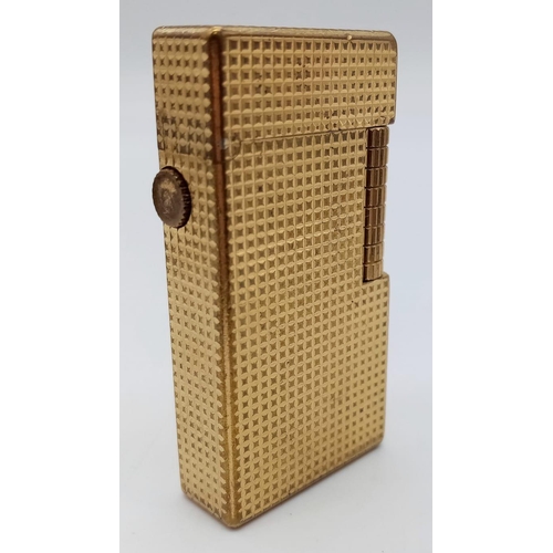 626 - A Vintage Dunhill Gold Plated 70 Lighter. Textured exterior - 6cm x 3cm. In need of flint and gas. C... 