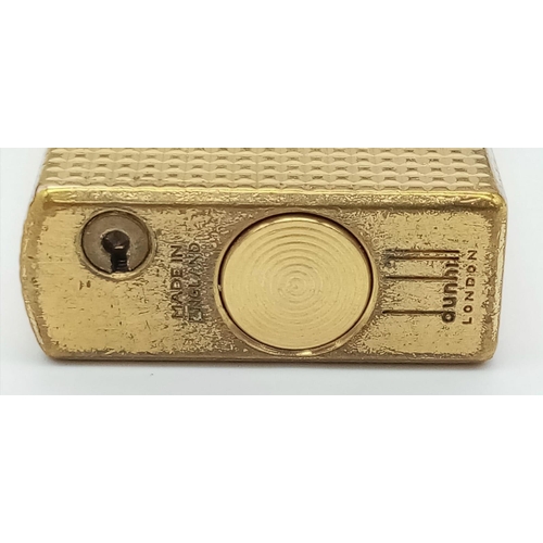 626 - A Vintage Dunhill Gold Plated 70 Lighter. Textured exterior - 6cm x 3cm. In need of flint and gas. C... 