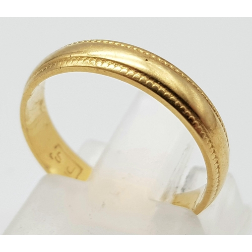 899 - An 18K Yellow Gold Band Ring. 4mm width. Size J. 2.3g weight. Full UK hallmarks.