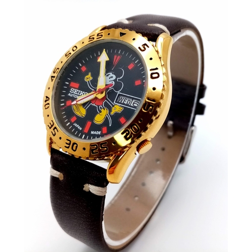 919 - A Seiko Automatic Mickey Mouse Watch. Brown leather strap. Gilded stainless steel case - 36mm. Decor... 