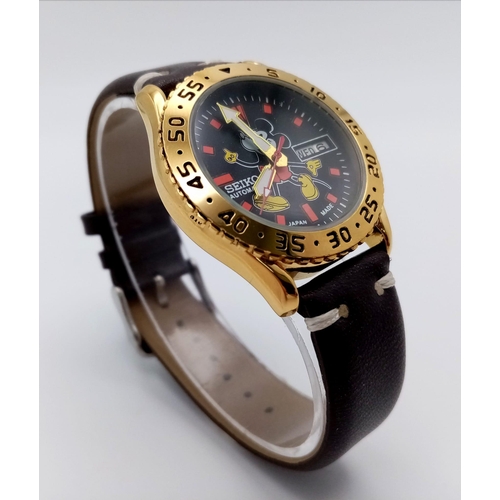 919 - A Seiko Automatic Mickey Mouse Watch. Brown leather strap. Gilded stainless steel case - 36mm. Decor... 