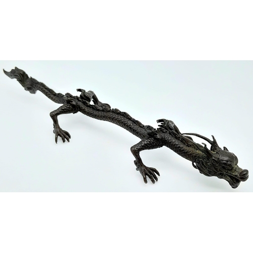 613 - An Antique Japanese Bronze Dragon Ornament 15.5cm Length.