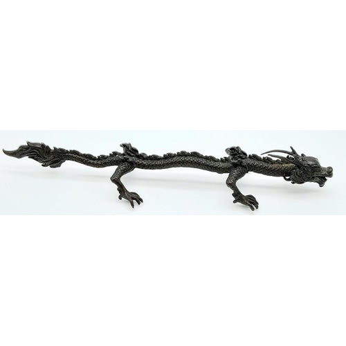 613 - An Antique Japanese Bronze Dragon Ornament 15.5cm Length.