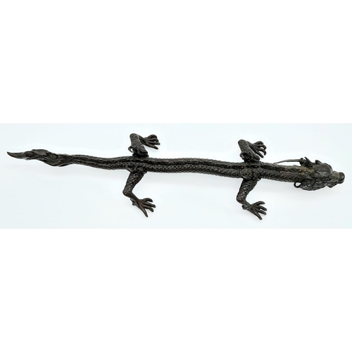 613 - An Antique Japanese Bronze Dragon Ornament 15.5cm Length.