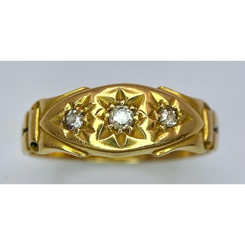 696 - An Antique 18K Yellow Gold Three Stone Diamond Ring. Three bright white diamonds in star settings. S... 