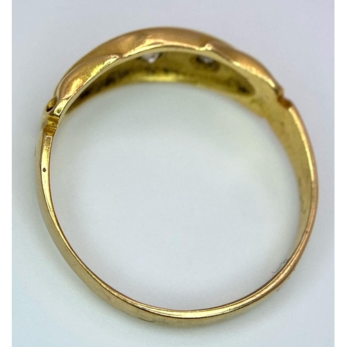 696 - An Antique 18K Yellow Gold Three Stone Diamond Ring. Three bright white diamonds in star settings. S... 