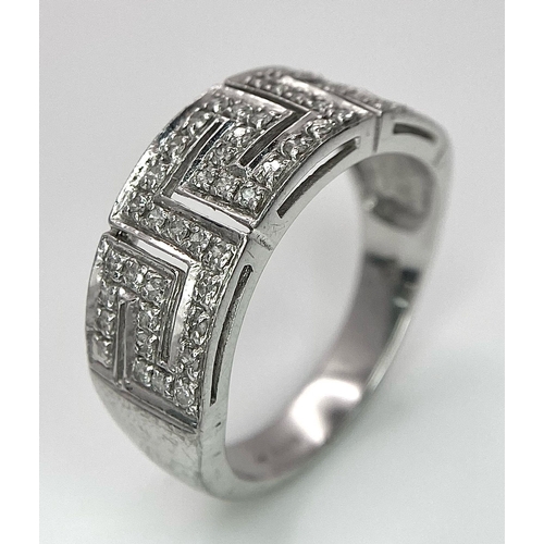 1405 - A 18K WHITE GOLD DIAMOND BAND RING. TOTAL WEIGHT 7.6G. SIZE T