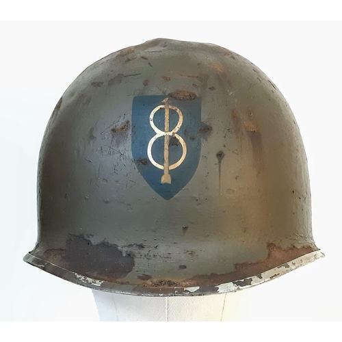 378 - WW2 US M1 Swivel Bale Helmet, with insignia of the 8 th Infantry Division. This helmet has the typic... 