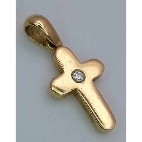 1224 - An 18K Yellow Gold and Diamond Cross Pendant. 2cm. 2.4g weight.