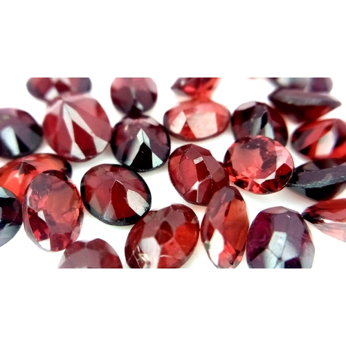 1330 - A Parcel of 28 Turkish Garnets, Oval Cut. 45.61 Carats Total.