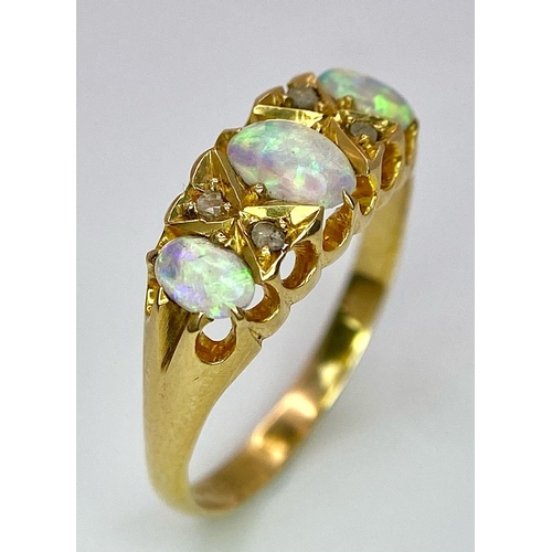 154 - A Mesmerising Antique 18K Yellow Gold, Opal and Diamond Ring. Three beautiful colour-play opals sepa... 