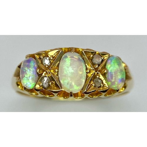 154 - A Mesmerising Antique 18K Yellow Gold, Opal and Diamond Ring. Three beautiful colour-play opals sepa... 