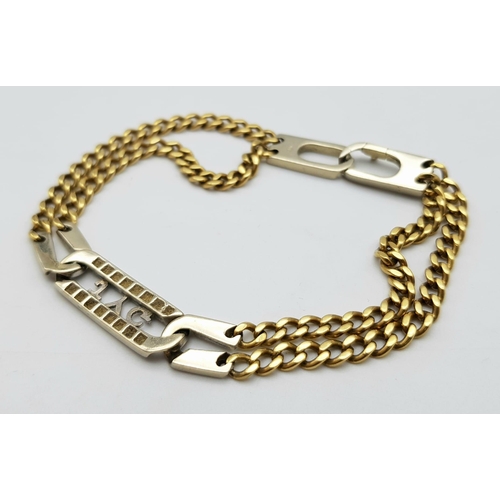 106 - An 18K Yellow and White gold Diamond Bracelet. A double row of flat yellow gold curb links connect t... 