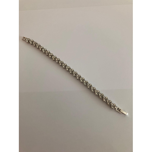 111 - Fabulous SILVER TENNIS BRACELET Set with 75 clear white sparkling Zirconias. 17cm.