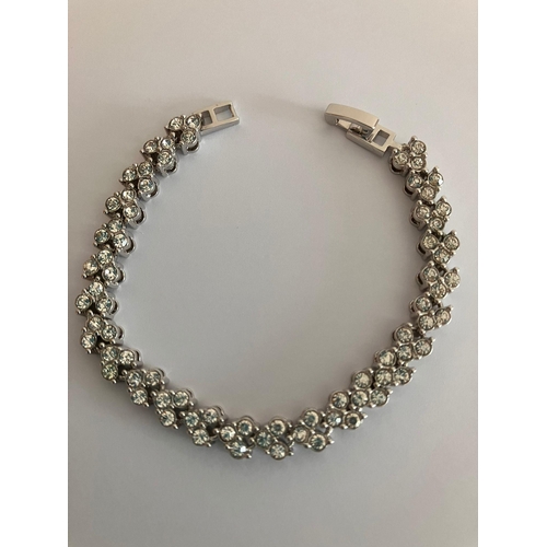 111 - Fabulous SILVER TENNIS BRACELET Set with 75 clear white sparkling Zirconias. 17cm.