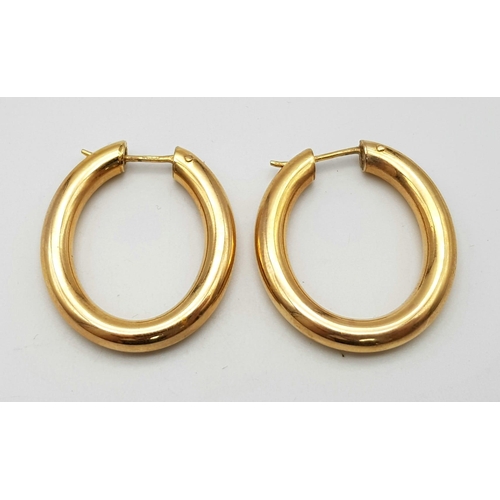 113 - A Classic Pair of Vintage Oval Hoop 9K Yellow Gold Earrings. 
6.3g total weight.