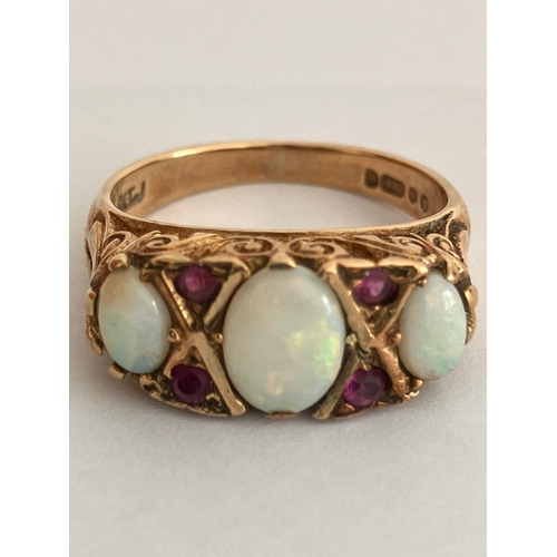 139 - Vintage 9 carat YELLOW GOLD,OPAL and RUBY RING. Full UK hallmark. Complete with jewellers vintage ri... 