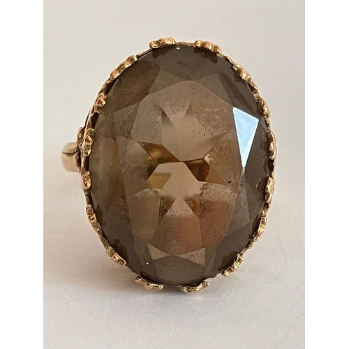 174 - 9 carat GOLD RING with Large Oval Cut  BROWN AMETHYST Set to top in attractive Regal Mount. Please s... 