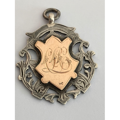 208 - Antique SILVER and 9 CARAT GOLD FOB MEDAL. Clear hallmark for Birmingham 1907. Combined weight 12.75... 