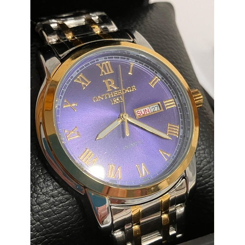 306 - Gentlemans ON THE EDGE Quartz Wristwatch. Day/date model, having royal blue face with golden Roman n... 