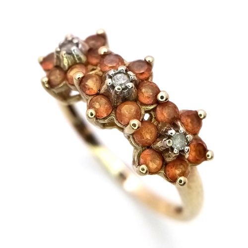 325 - A LOVELYU 9K YELLOW GOLD (TESTED AS) DIAMOND & GEMSTONE RING IN FLORAL DESIGN - 0.03CT DIAMOND - 2.2... 