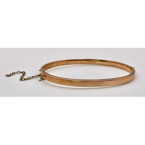 421 - A Vintage 9K Rose Gold Bangle. Clip open design. 6cm inner diameter. 4.5g weight.