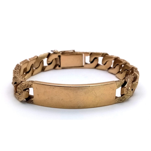 471 - A CHUNKY 9K GOLD I.D. BRACELET WITH BARK EFFECT LINKS AND SAFETY CHAIN .   59.2gms