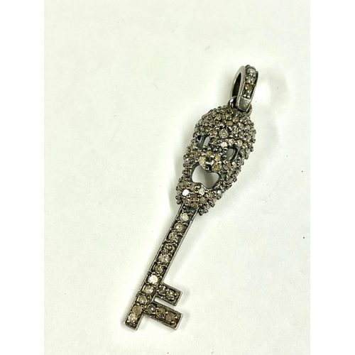 779 - Diamond encrusted memento mori skull key pendant . 4.5cm .