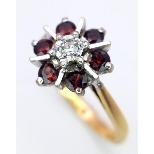 123 - 18K YELLOW GOLD DIAMOND & GARNET SET RING IN FLORAL DESIGN, WEIGHT 3.3G SIZE L.	
SC 4092