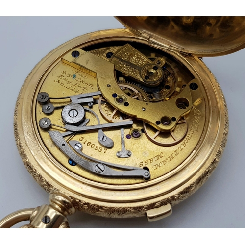 15 - An Antique Waltham 18K Gold Full Hunter Pocket Watch. The case is ornately decorated in a floral pat... 