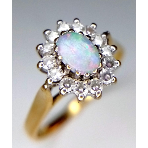 297 - 9K YELLOW GOLD OPAL AND CZ RING - 5MMX6MM OPAL CENTRE WITH HALO OF CZ STONE SETTING - 2.4G TOTAL WEI... 