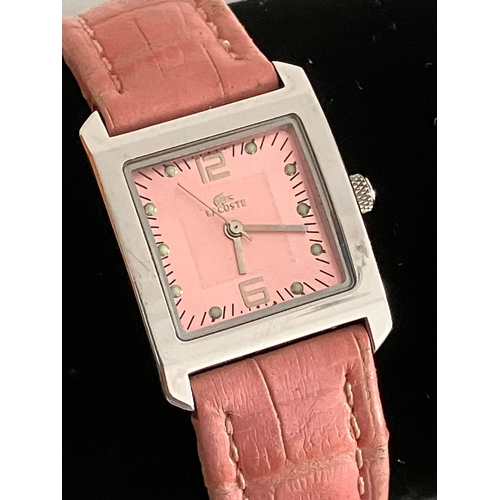 405 - Ladies LACOSTE WRISTWATCH. Finished in stainless steel silver tone.Pink Square face. Model 6800L. Pi... 