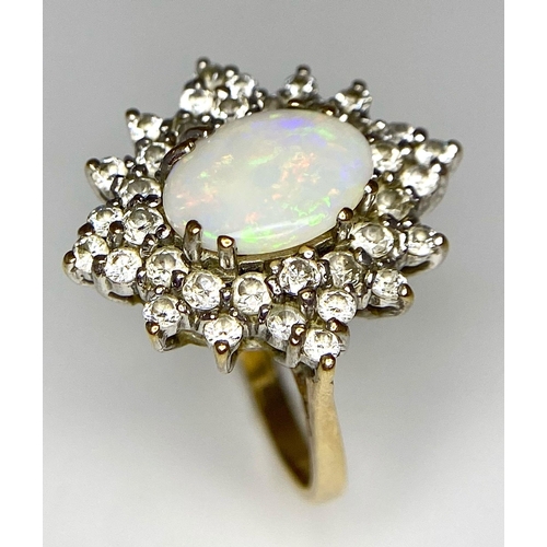 484 - A FABULOUS OPAL AND DIAMOND CLUSTER RING SET IN PLATINUM  AND WITH A 9K GOLD SHANK .   4.2gms   size... 