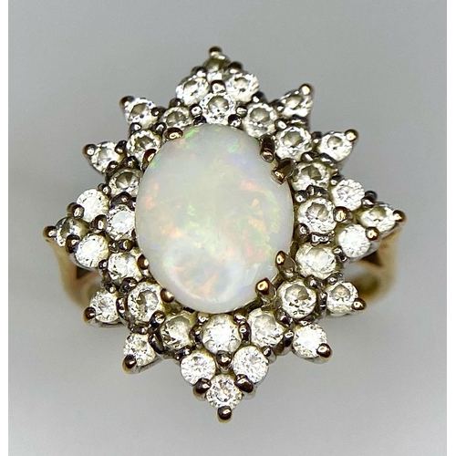 484 - A FABULOUS OPAL AND DIAMOND CLUSTER RING SET IN PLATINUM  AND WITH A 9K GOLD SHANK .   4.2gms   size... 