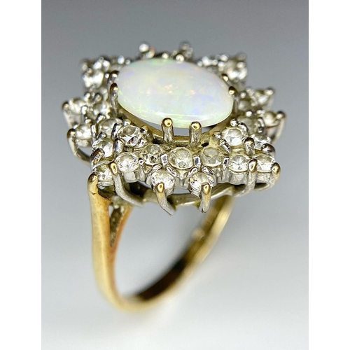 484 - A FABULOUS OPAL AND DIAMOND CLUSTER RING SET IN PLATINUM  AND WITH A 9K GOLD SHANK .   4.2gms   size... 