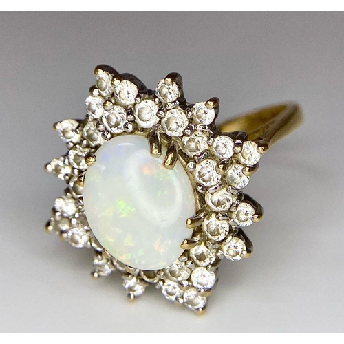 484 - A FABULOUS OPAL AND DIAMOND CLUSTER RING SET IN PLATINUM  AND WITH A 9K GOLD SHANK .   4.2gms   size... 