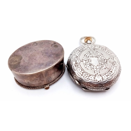 750 - Two Antique Silver Items: A miniature hallmarked (935) pocket watch with enamel decoration. 3.5cm di... 