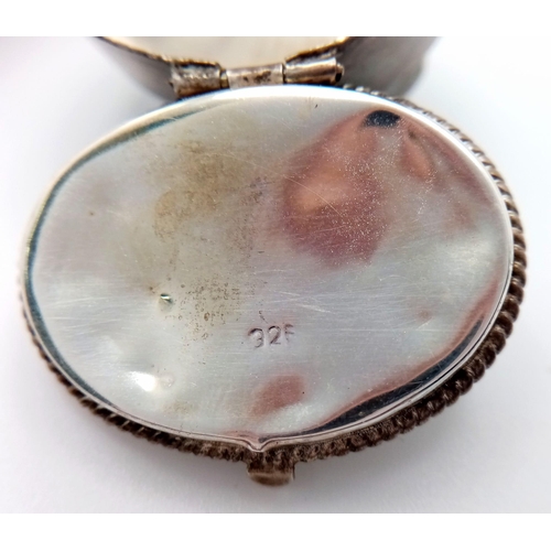 750 - Two Antique Silver Items: A miniature hallmarked (935) pocket watch with enamel decoration. 3.5cm di... 