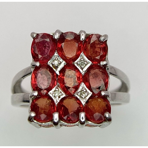 158 - A 9K WHITE GOLD ORANGE STONE SET FANCY RING 4.3G SIZE N.

SC 4005