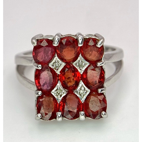 158 - A 9K WHITE GOLD ORANGE STONE SET FANCY RING 4.3G SIZE N.

SC 4005