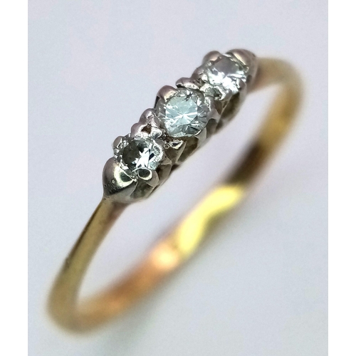 169 - A Vintage 18K Yellow Gold Diamond Trilogy Ring. 0.40ctw of brilliant round cut diamonds. Size M 1/2.... 