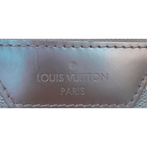 17 - A Louis Vuitton Damier Ebene Eole Convertible Travel Bag. Leather exterior with gold-toned hardware,... 