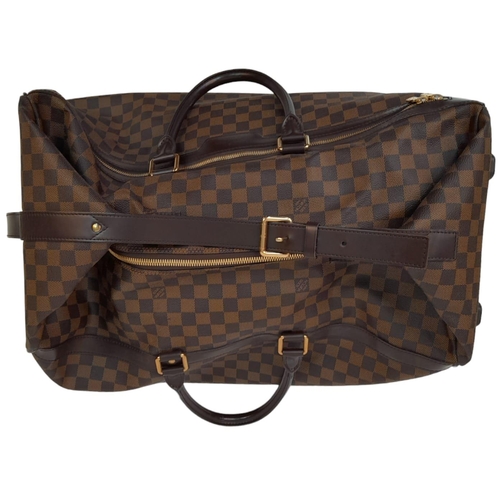 17 - A Louis Vuitton Damier Ebene Eole Convertible Travel Bag. Leather exterior with gold-toned hardware,... 