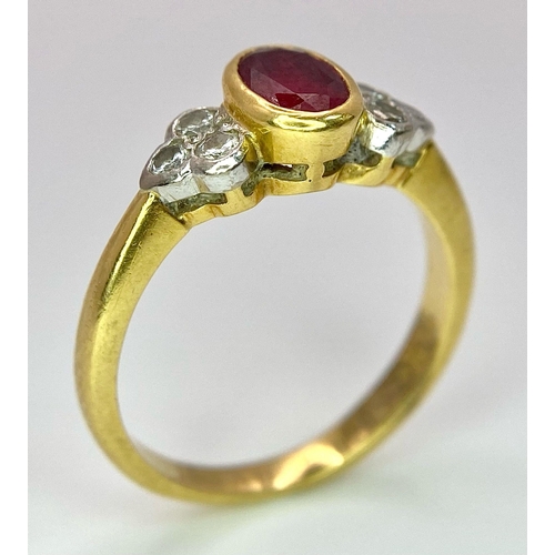 32 - An 18K Yellow Gold Ruby and Diamond Ring. Central oval ruby with six round cut diamond accents. Size... 