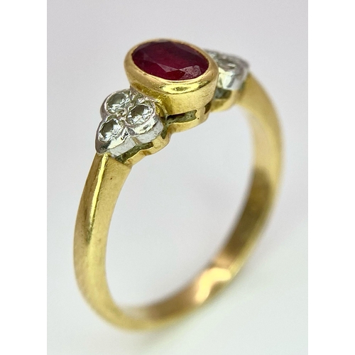 32 - An 18K Yellow Gold Ruby and Diamond Ring. Central oval ruby with six round cut diamond accents. Size... 